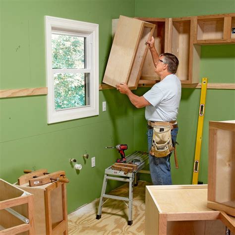 mounting kitchen cabinets to wall